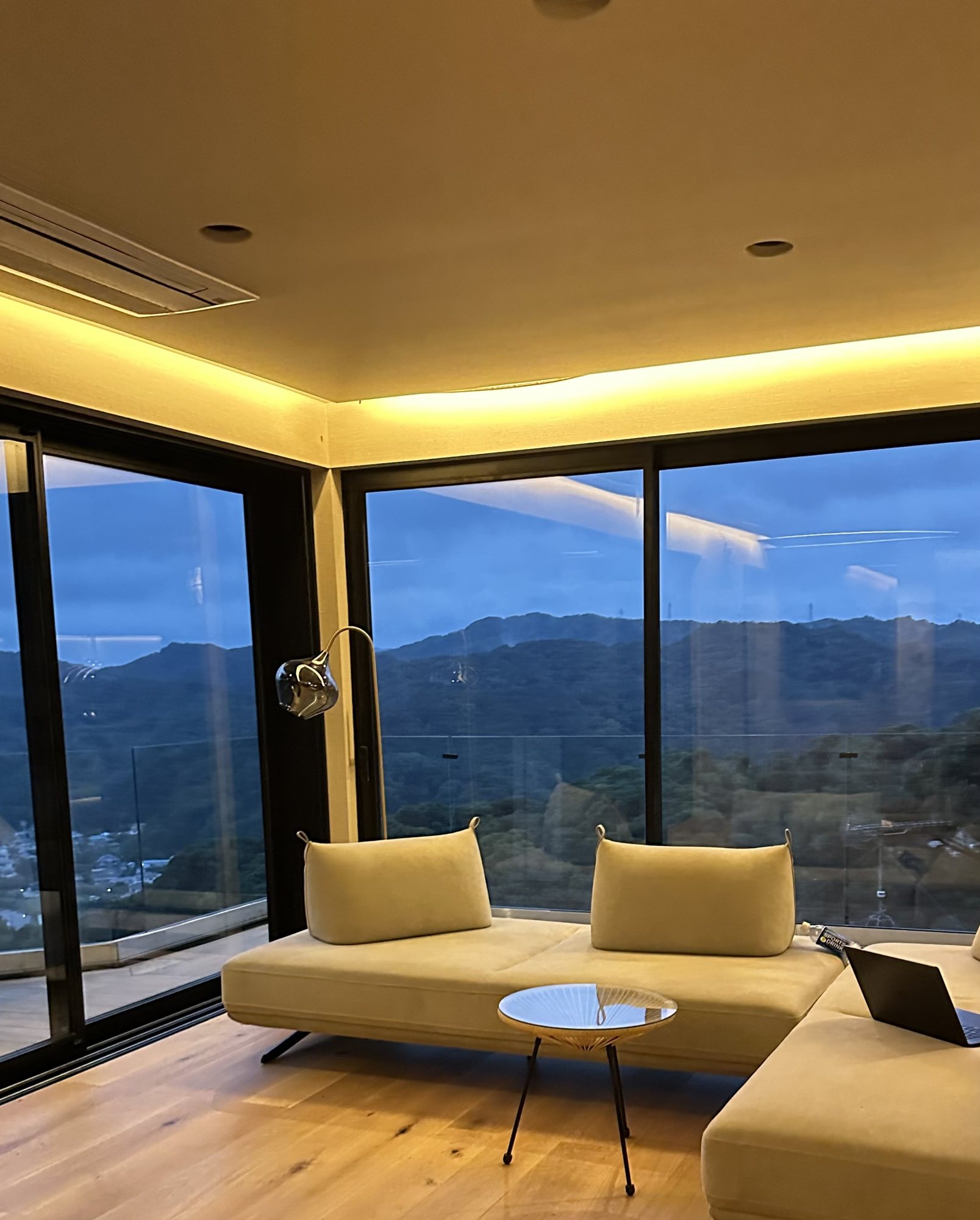 The living room of the main villa at dusk